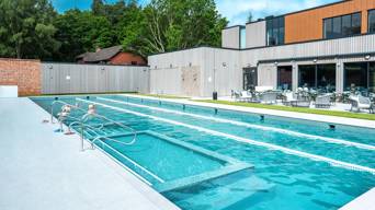 Outdoor pool with people