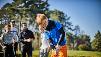 Boy playing golf